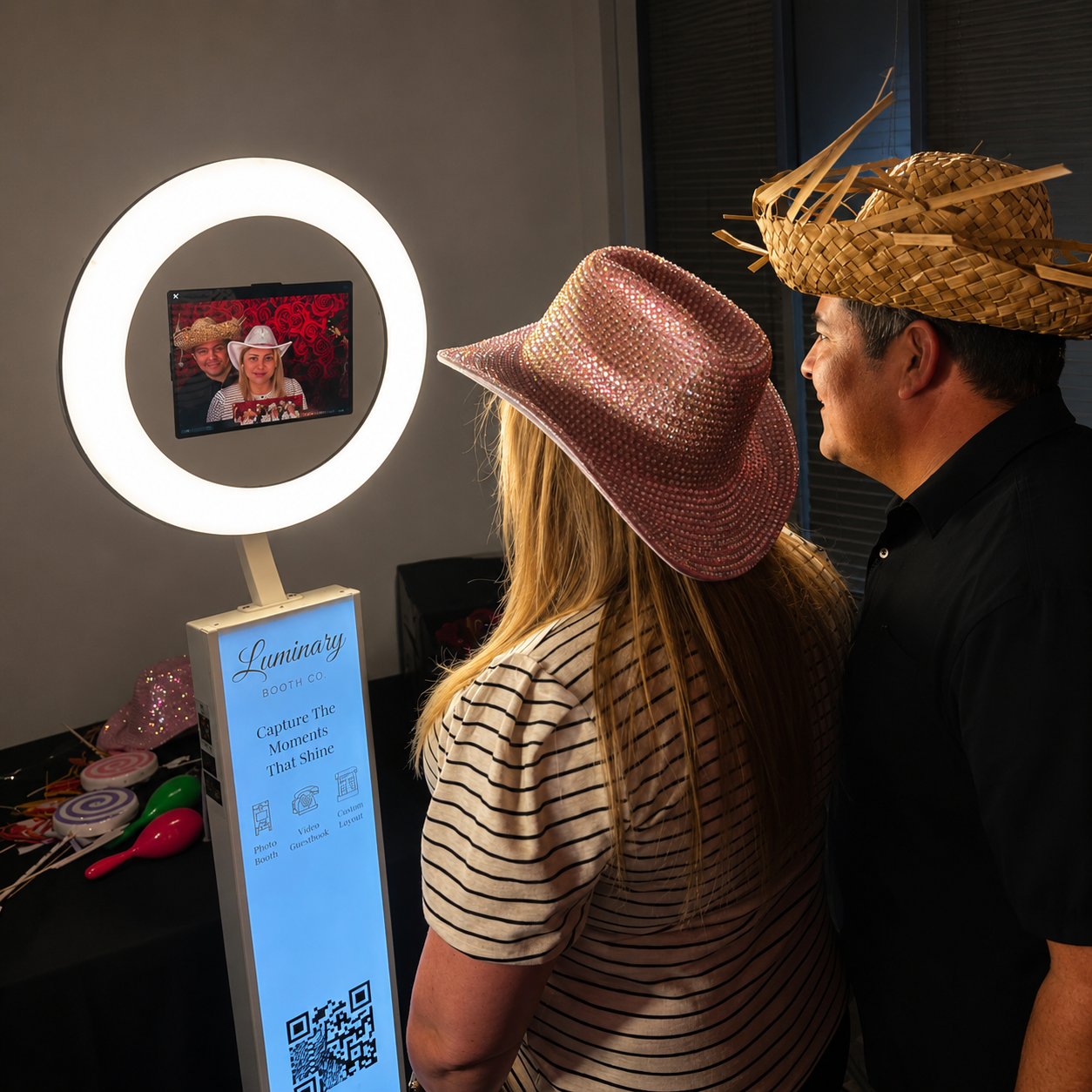Guests celebrating at the Luminary mirror photo booth